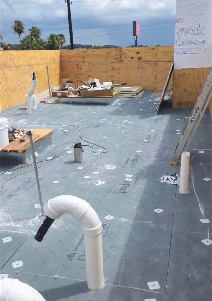 Commercial flat roof substrate, DensDeck insulation, and parapet wall framing