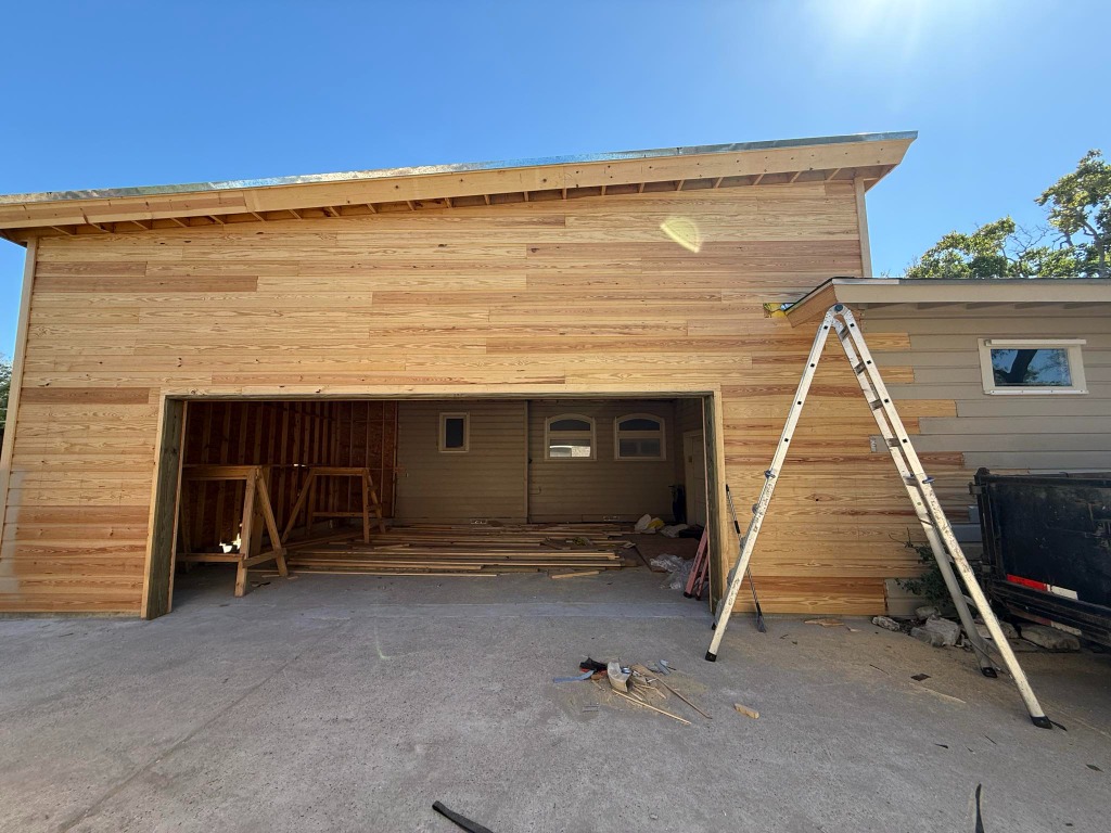 Structural garage addition and exterior horizontal siding installation