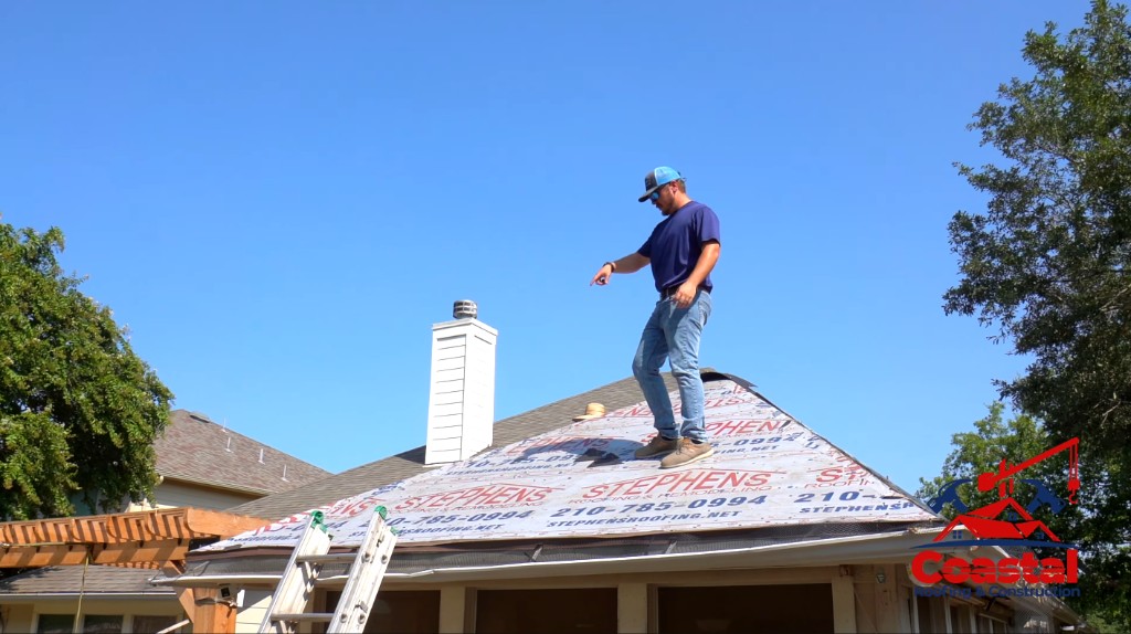Coastal Roofing and Construction specialist conducting rooftop inspection and underlayment evaluation in Corpus Christi